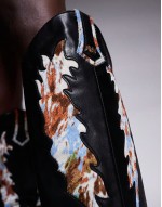 Dumas cow print western knee boots in black