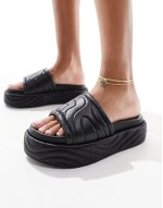 ‌Stylish Mylo flatform slider in black