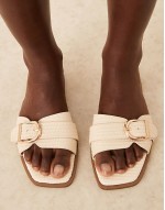 Nikola buckle flat sandals in natural raffia